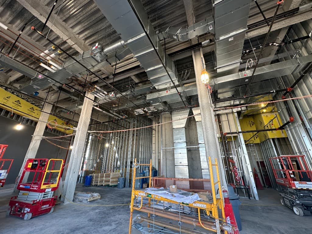 Active commercial construction site with coordinated MEP systems